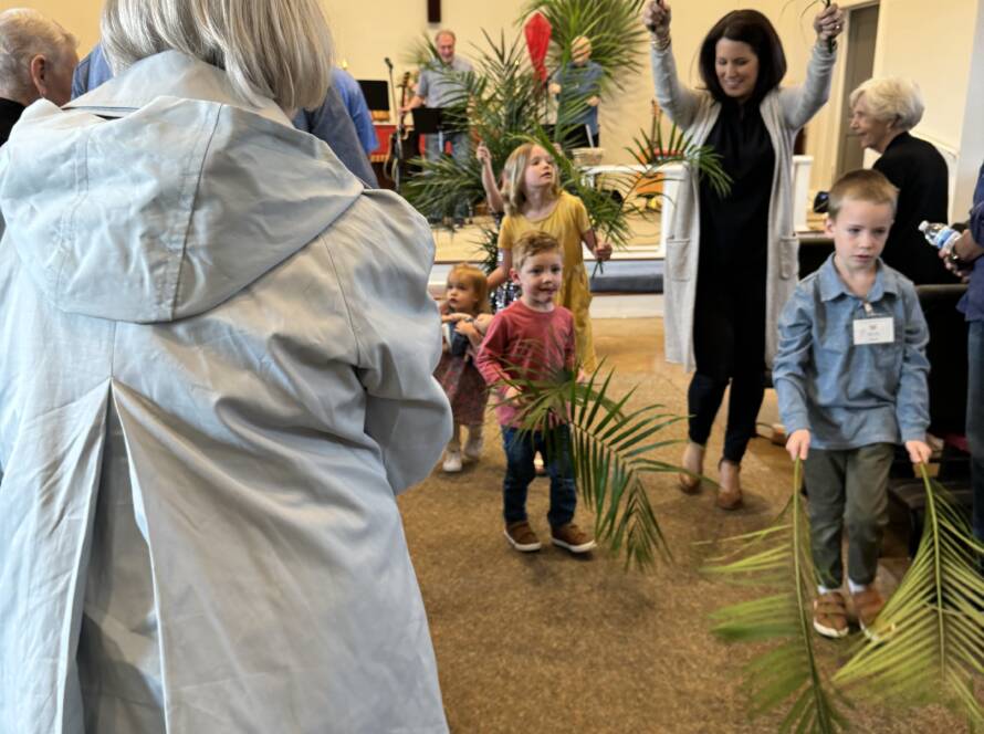 Palm branches and people in church.