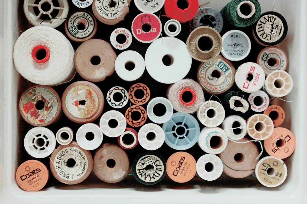 A bunch of different types of sewing thread