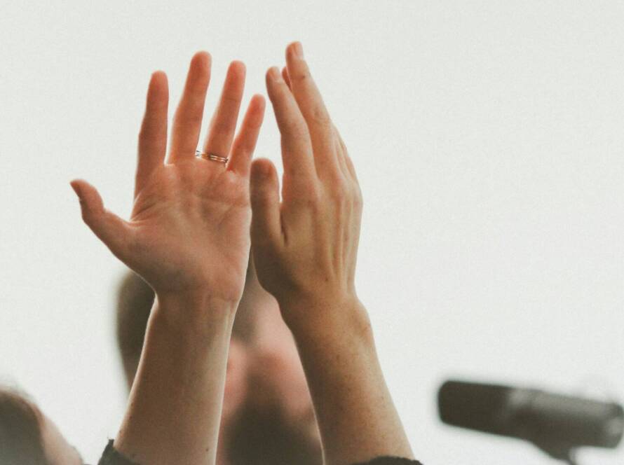 A person with their hands up in the air