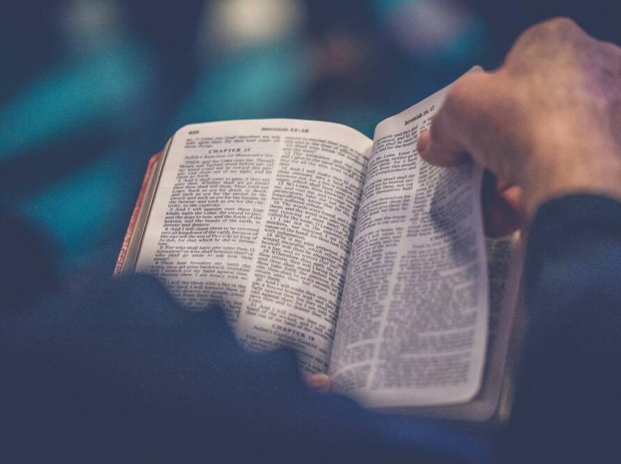 A person reading from the Bible.