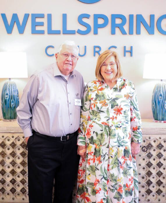 Elderly couple standing at Wellspring Church.