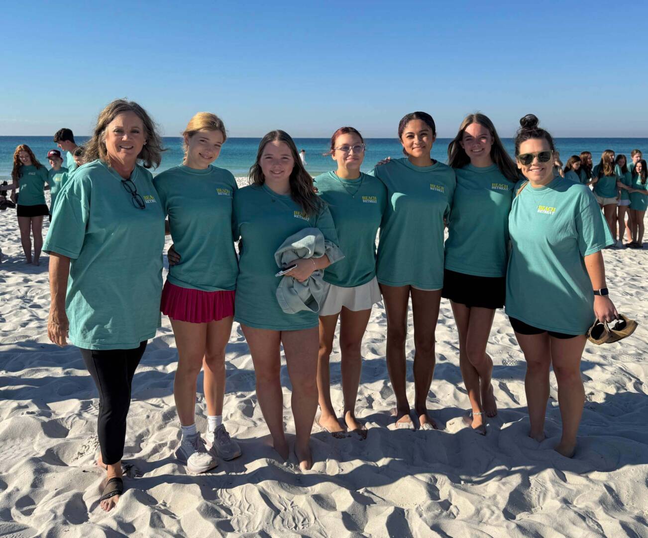 Group of people on a sunny beach.