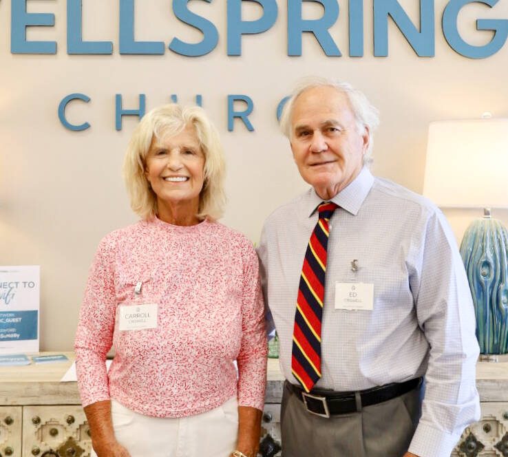 Elderly couple smiling at Wellspring Church.