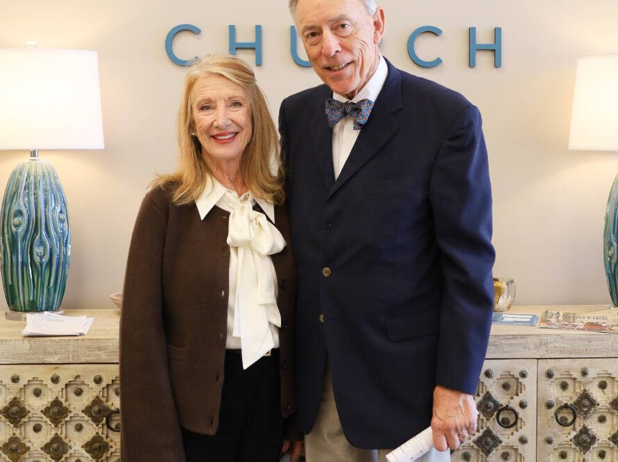Elderly couple standing inside Wellspring Church.