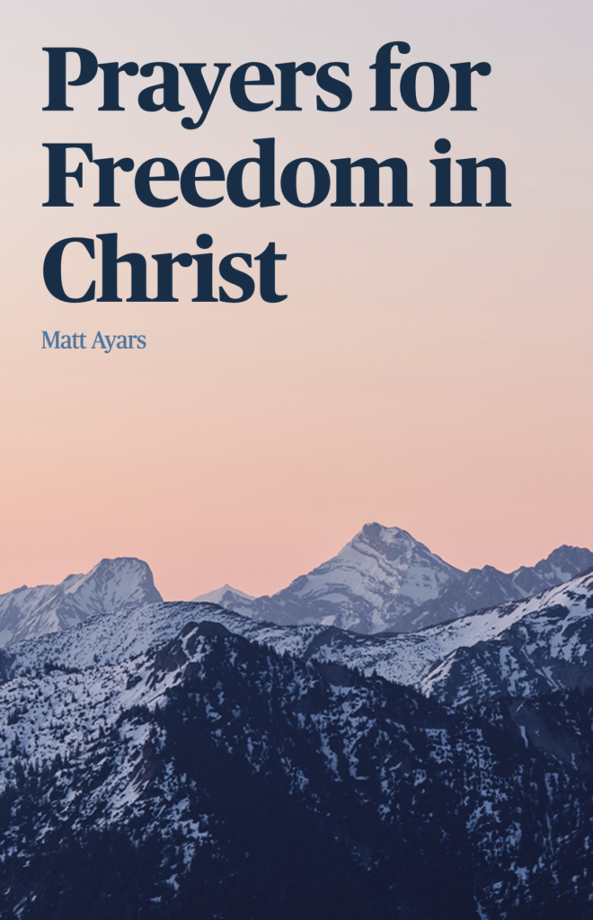Book cover with mountains at sunset.