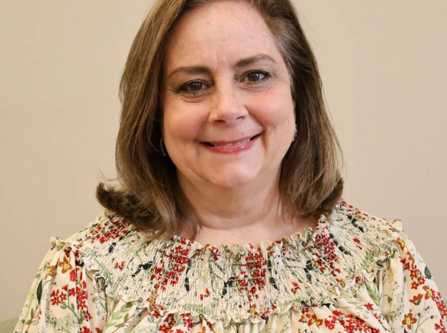 Smiling woman in floral blouse