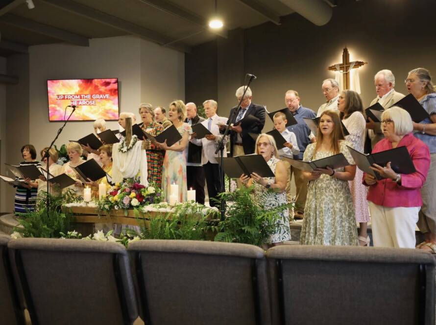 Church choir singing in sanctuary before congregation